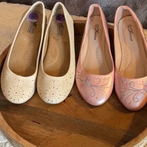 Two pair of ballerina flats. One Pink and one Cream Colored. Women size …